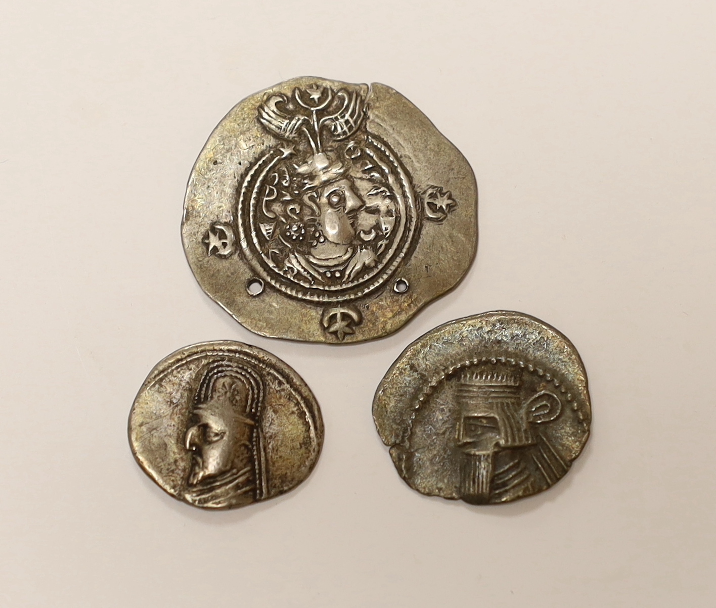 Sasanian Kingdom AR drachm, 4g, holed and clipped otherwise VF and Parthian Kingdom, two AR drachm, 3.45g and 4g, fine or better (3)